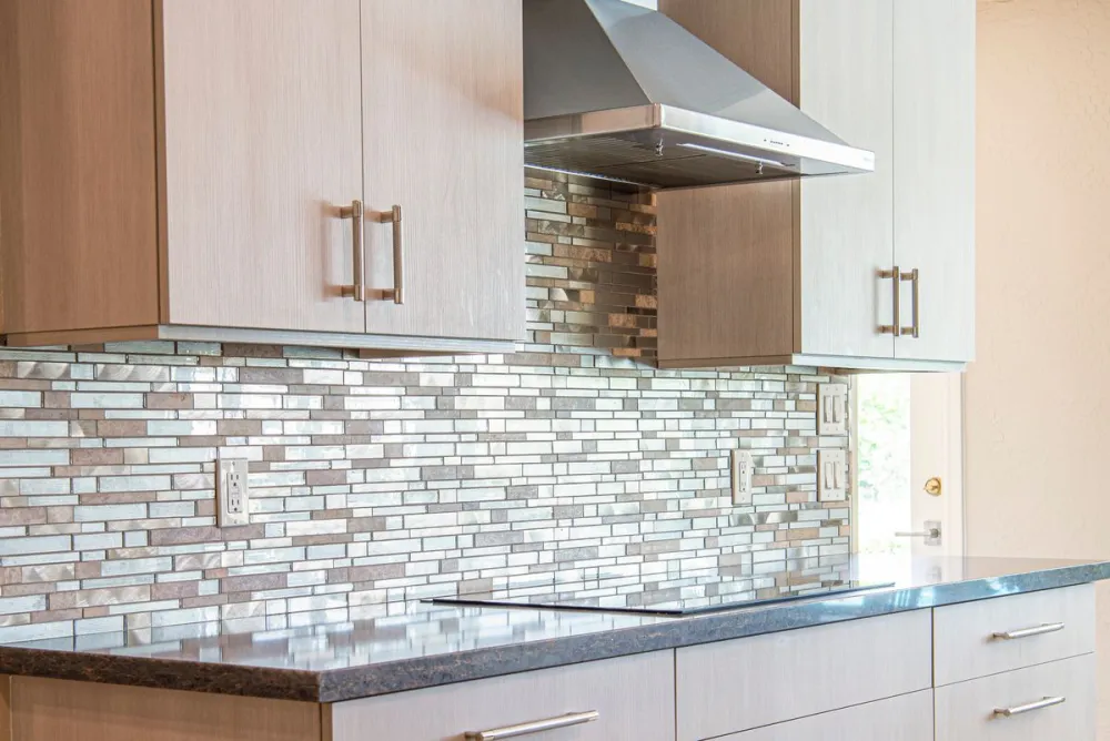 Tile backsplash behind a kitchen counter