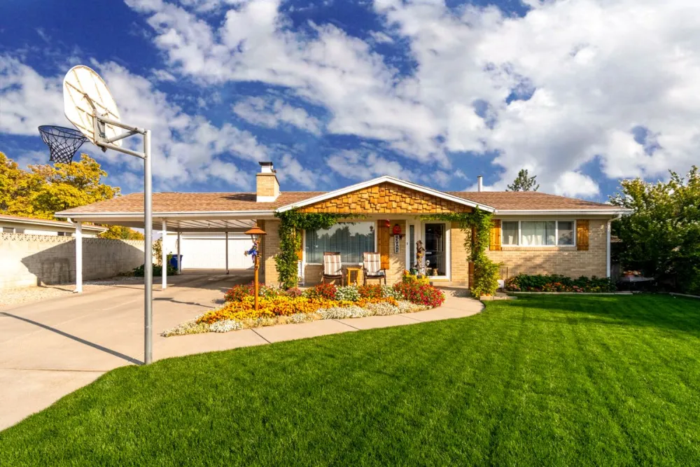 Freshly planted flower beds and a manicured lawn at a home